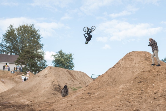Scott Cranmer throwing a backflip over the banger set for 2nd place in the Dirt Jump Comp.  He had an awesome time racing too, throwing big smiles all day long.  Photo: Eric Silver