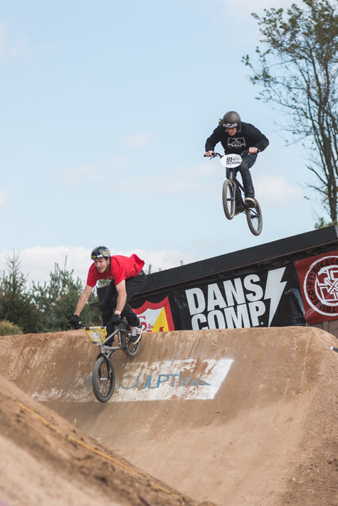 Chris Doyle leads Van Homan off the roof jump. Photo: Eric Silver