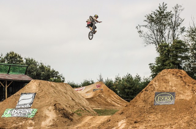 Chris Doyle with a clicked table over the big set. Doyle was the only rider to place top three in both the Double Cross and the Dirt Jump Comp. Photo: Troy Zeigler / Elevated Visuals