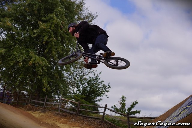 FIT's Justin Inman raced the TRA downhill course brakeless, and in perfect control, almost catching Chris Doyle on the last straight…and he did it all with an old-school one-footed start. Photo: Al Cayne / Sugarcayne.com
